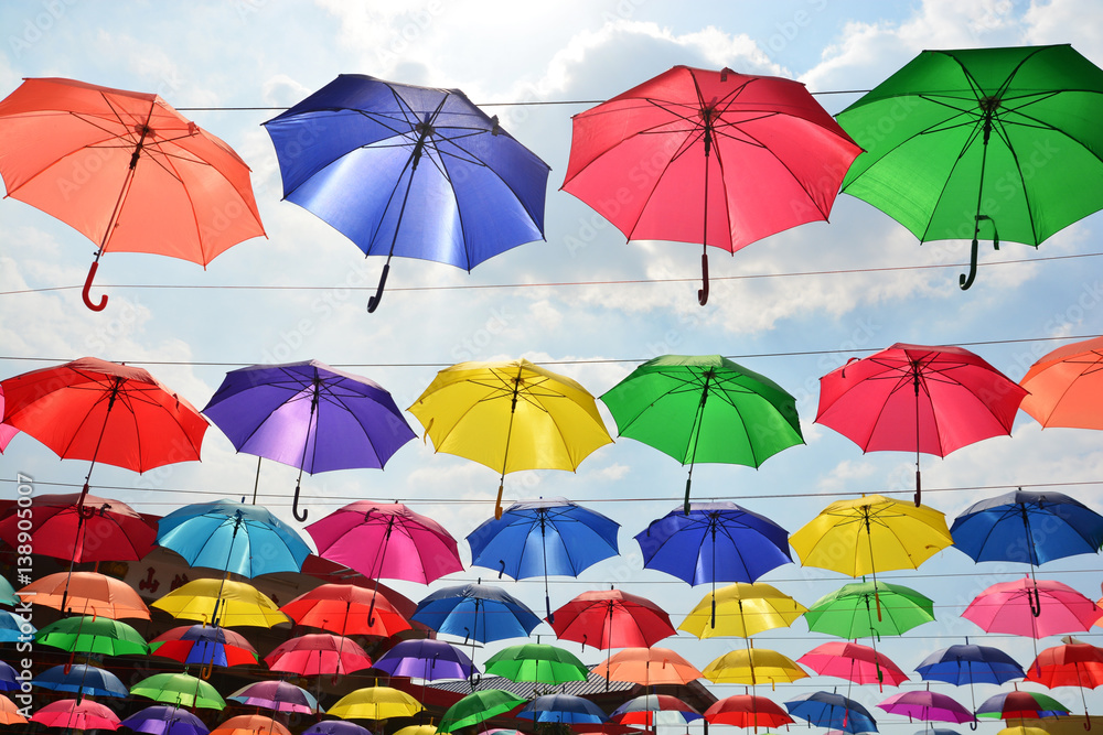 Colorful umbrellas background. Coloruful umbrellas urban street decoration.