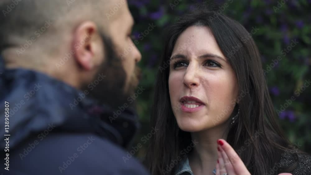 brunette yelling to her boyfriend in a park brunette yelling to her boyfriend in a park
