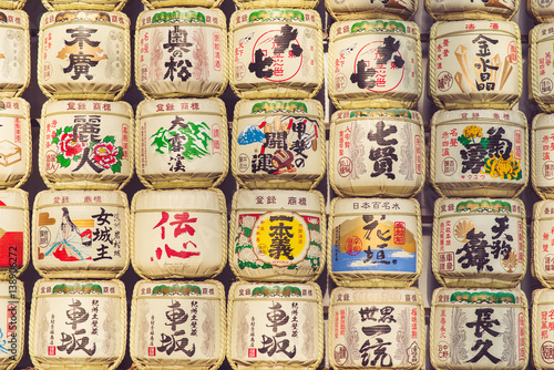 TOKYO, JAPAN - MARCH 30: A collection of Japanese sake barrels stacked is at the Japanese Meiji Shrine.