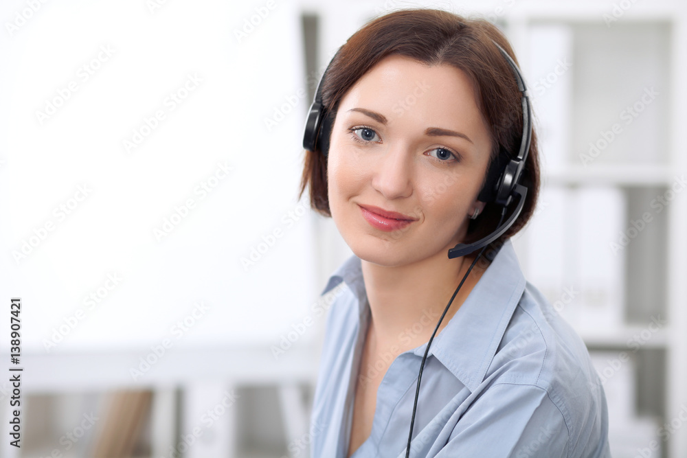 Young beautiful business woman in headset. Call center. Young beautiful business woman in headset. Call center.