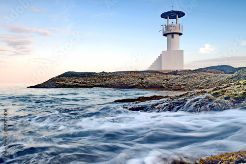 light house wave and sunset photo