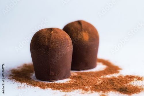 Fényképezés Two chocolate truffles covered in cinnamon