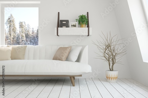 White room with sofa and winter landscape in window. Scandinavian interior design