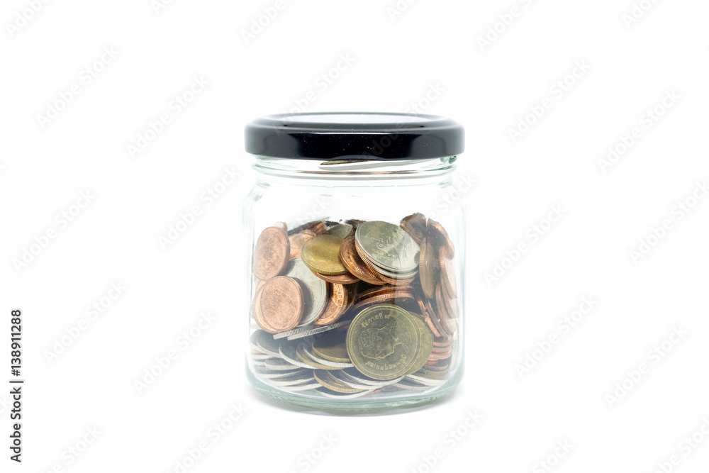 coin in glass bottle on white background coin in glass bottle on white background