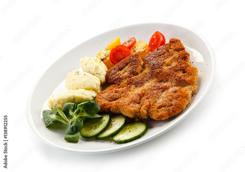 Fried pork chop, puree and vegetables 