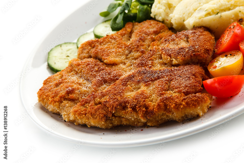 Fried pork chop, puree and vegetables 