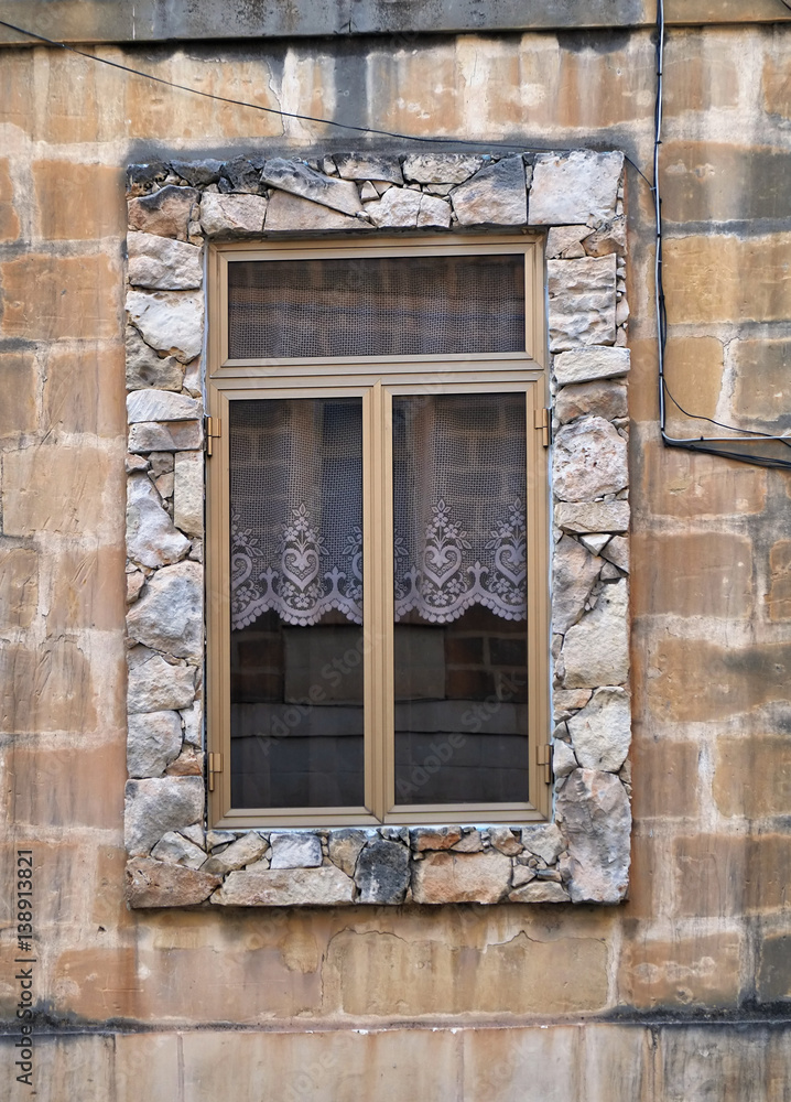 Window in a stone frame. Malta