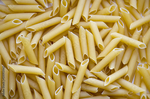 Pasta background, texture, close-up Italian Penne, high resolution picture