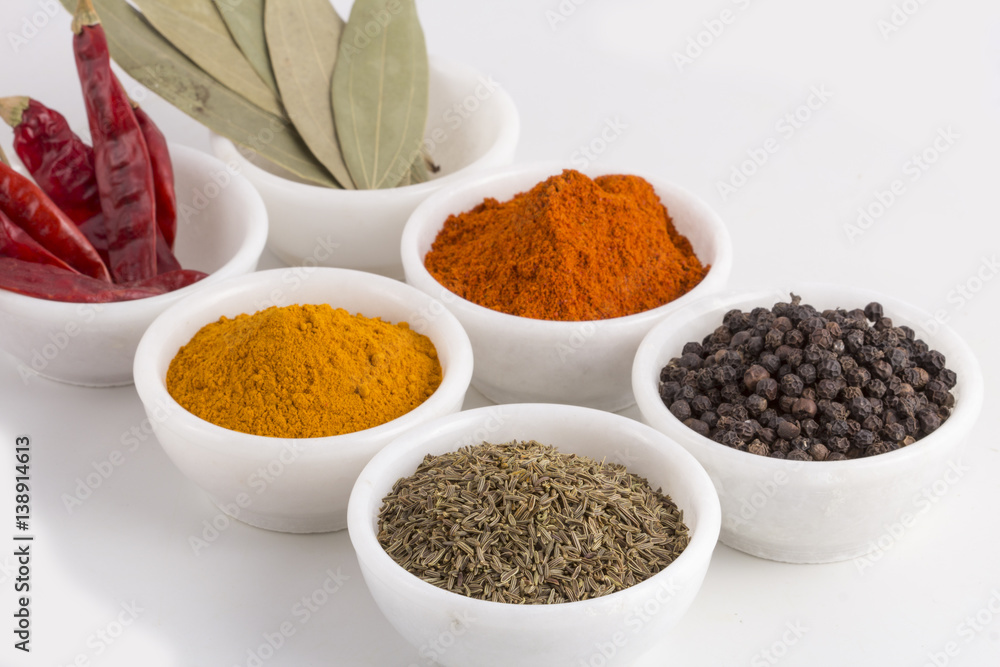 Indian Spices in Bowl on white background Indian Spices in Bowl on white background