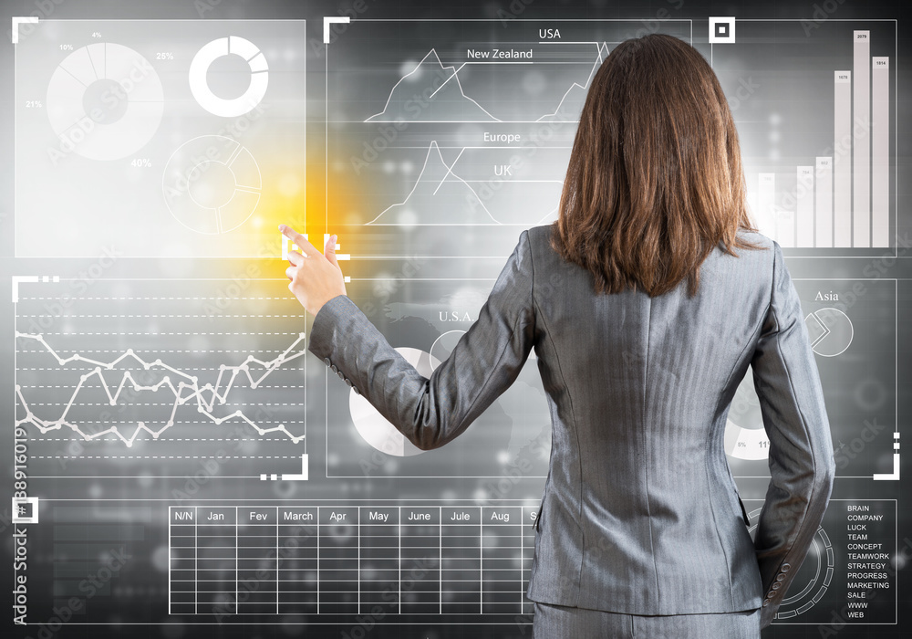 Businesswoman standing with back and pressing icon on media screen Businesswoman standing with back and pressing icon on media screen