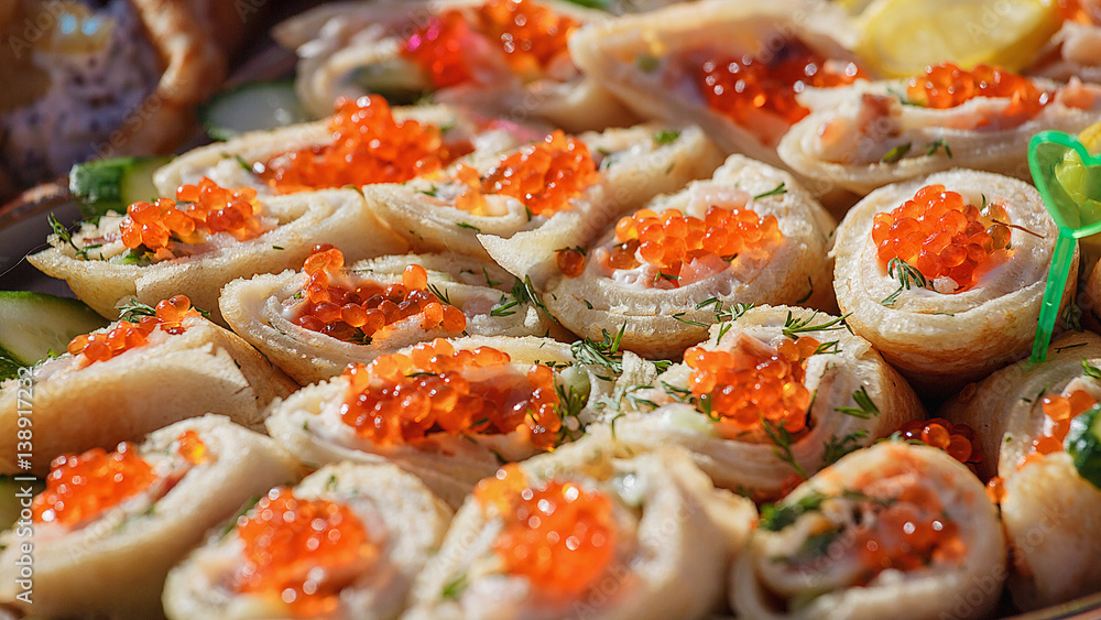 Pancakes - a festive meal on Shrove Tuesday. Pancakes with red caviar. A traditional dish of Slavic cuisine. Selective focus Pancakes - a festive meal on Shrove Tuesday. Pancakes with red caviar. A traditional dish of Slavic cuisine. Selective focus