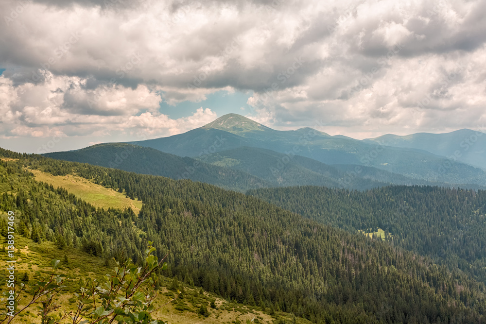 Summer landscape in mountains and the dark blue sky with clouds Summer landscape in mountains and the dark blue sky with clouds