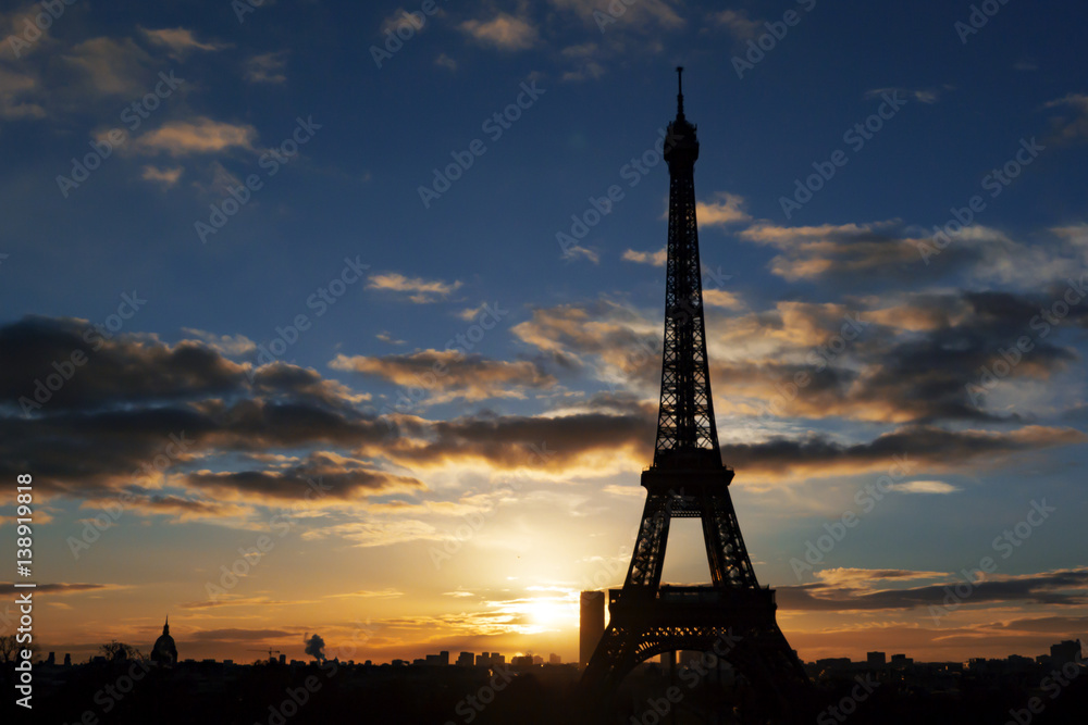 Eiffel Tower silhouette with sunset background