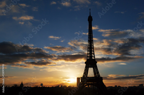 Eiffel Tower silhouette with sunset background