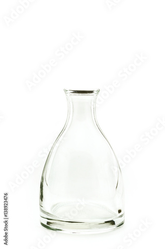 Single transparent bottle grass on white background.