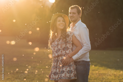 Loving and happy couple at sunset