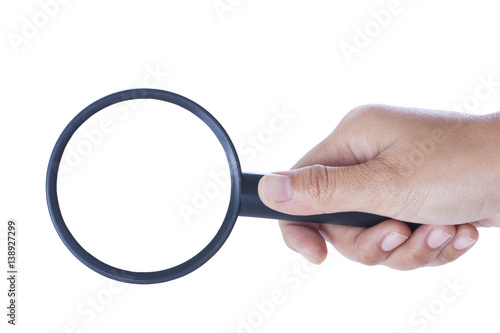 hand holding the magnifying glass on white background