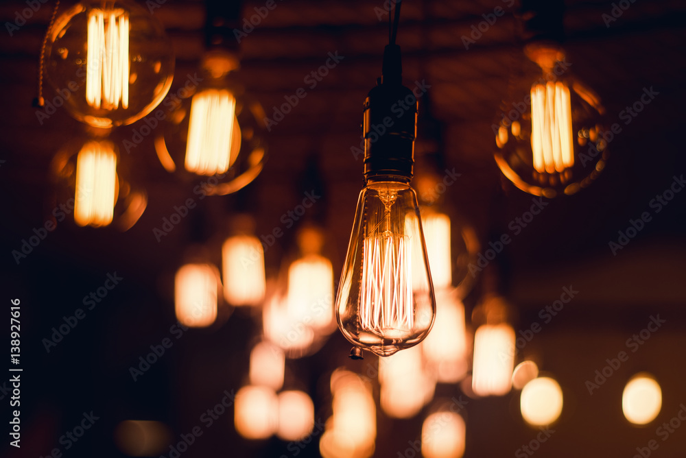Shot of a lightbulbs turned on isolated on black Shot of a lightbulbs turned on isolated on black