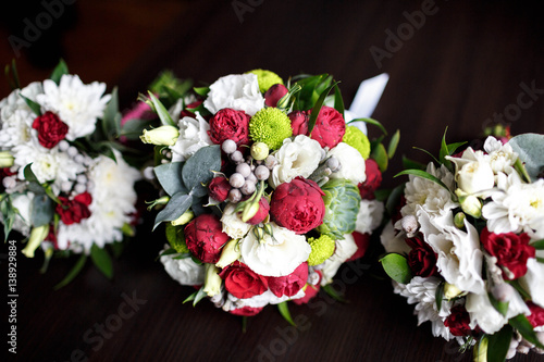 three beautiful wedding bouquets of delicate flowers