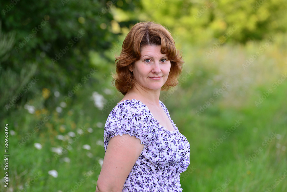 woman in a summer dress in nature