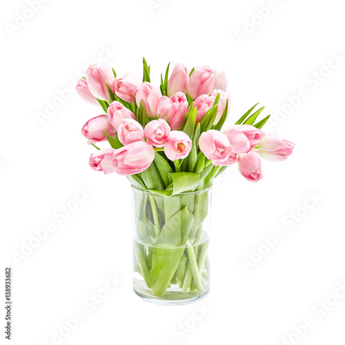 Fototapeta Naklejka Na Ścianę i Meble -  Pink tulips bouquet in glass vase. Isolated over white background 
