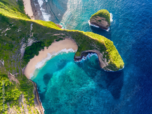 Tropical beach and cliff on the island of Nusa Penida, Indonesia photo