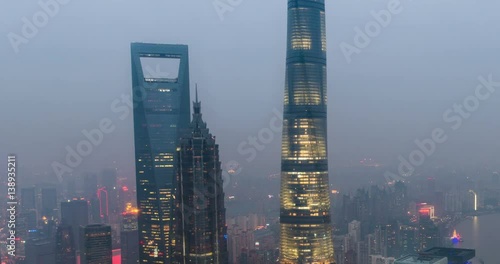 Time-lapse of Shanghai's three tallest skyscrapers, the Shanghai World Financial Center, the Jin Mao Tower, and the Shanghai Tower at sunset photo