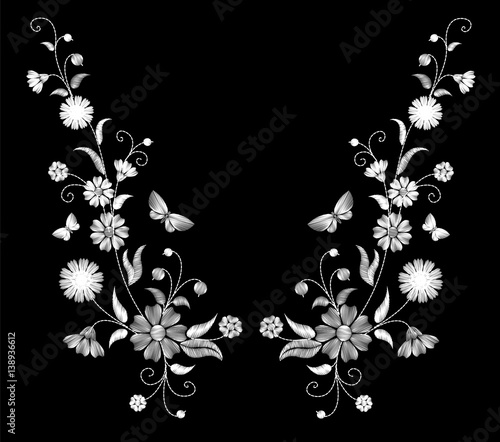 Embroidery white wild flowers on a black background