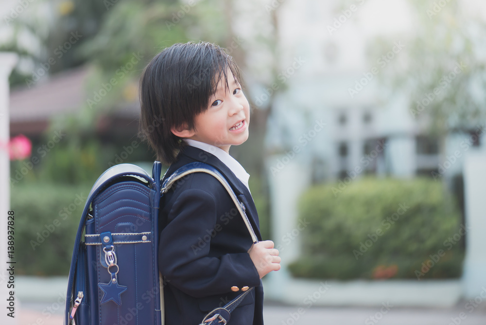 Asian student with backpack look at camera Asian student with backpack look at camera