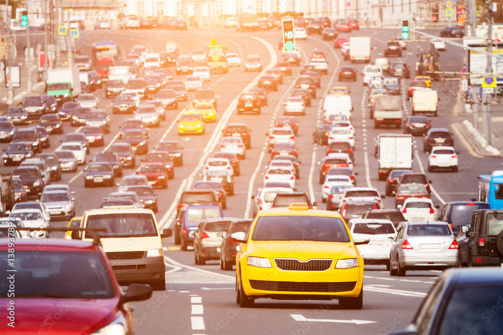 Wide city street full of cars