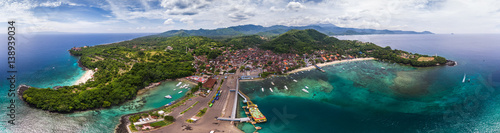 Fototapeta Naklejka Na Ścianę i Meble -  Aerial panorama of the tropical lagoon and marine port in the town of Padang Bai, Bali, Indonesia