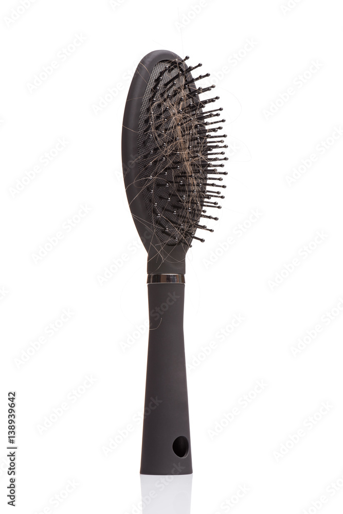 Hair loss problem - black hair comb brush with lost hair on it, isolated white background. Full depth of field with clipping path. Hair loss problem - black hair comb brush with lost hair on it, isolated white background. Full depth of field with clipping path.