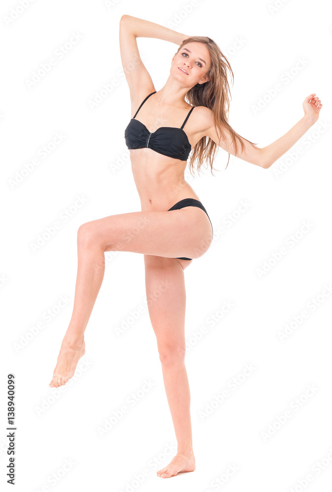 Sexy young woman posing in a black bikini, isolated on white background 