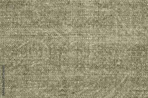 Homespun hemp cloth. Close-up of texture fabric cloth textile background. Homespun hemp fabric material. Homespun hemp canvas. Natural authentic cloth. Khaki color