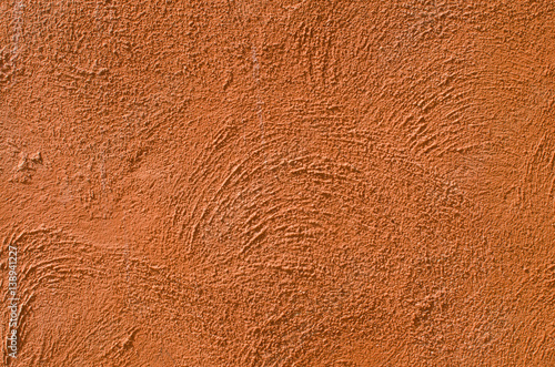 Distressed Red Plaster Wall With Cracked Surface Wide Grunge Background. Brown Brick Mortar Wall With Broken Shabby Stucco Isolated Texture. Empty Grunge Rustic Exterior House Wall Orange Surface.