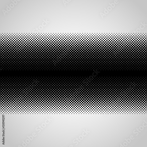 Halftone abstract black dots design element isolated on a white background.