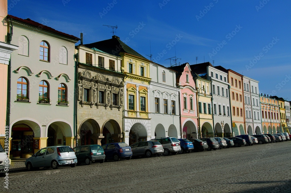 Naklejka premium Main Smetana Square in Litomysl, Pardubice Region, Czech Republic. Elongated street with baroque, classical and empire style facades of houses and originally preserved arcades.