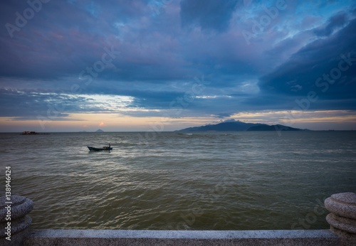 A colourful cloudy evening sky over the south china sea and coastal islands in Nha Trang Vietnam.