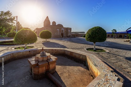 Mausoleum of Chashma-Ayub in Bukhara at sunset photo