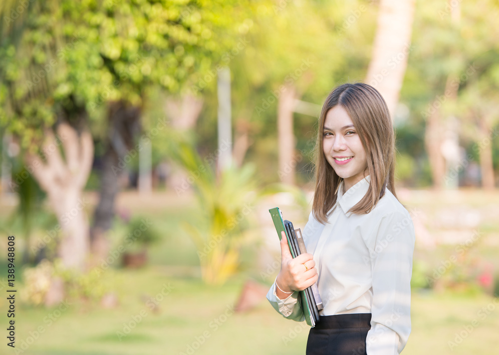 Portrait of young Asian business woman smiling outdoor Portrait of young Asian business woman smiling outdoor