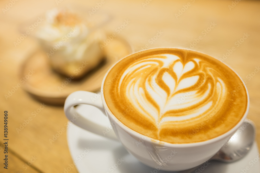 Coffee latte art on wooden table. Coffee latte art on wooden table.