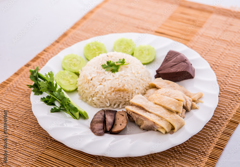 hainanese chicken rice in plate Stock Photo | Adobe Stock