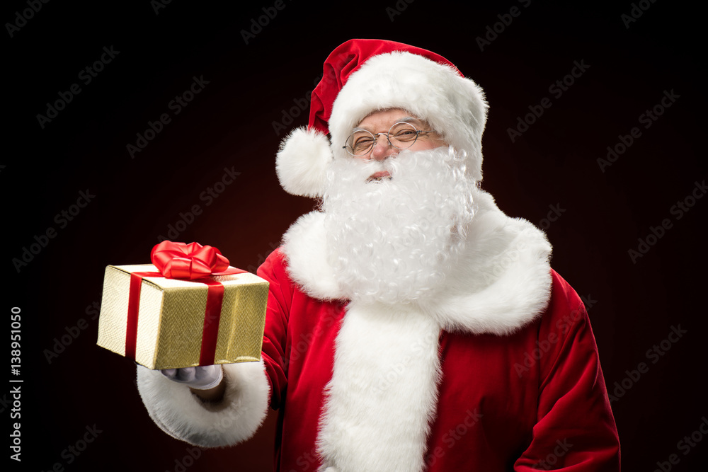 Santa Claus with gift box in hand Santa Claus with gift box in hand