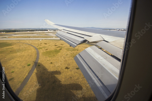 747 landing with shadow below