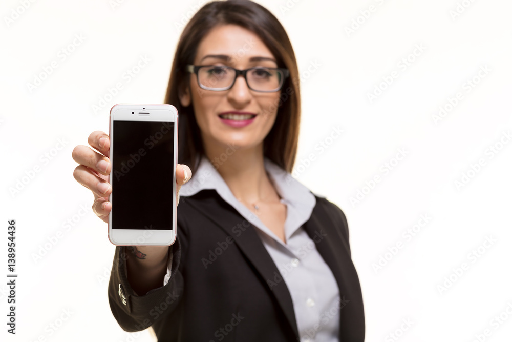 Businesswoman showing a blank smart phone screen Businesswoman showing a blank smart phone screen