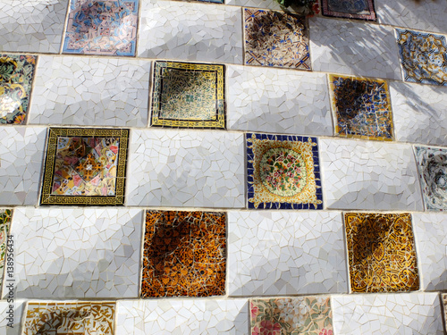 The mosaic wall by Antonio Gaudi in the Park Guell in Barcelona, Spain.