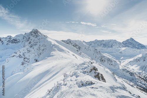 Winter snow covered mountain peaks in Europe. Great place for winter sports. © vladdeep