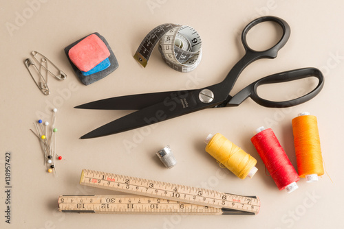 Basic Sewing Equipment on an Off-White Background