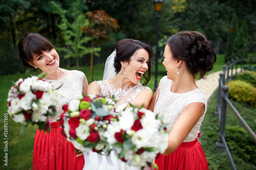 beautiful bride and her bridesmaids having fun together