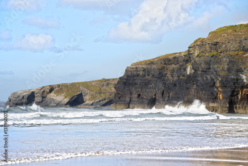 sepia soft waves breaking on the high cliffs